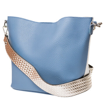 Blue leather womens handbag with patterned shoulder strap isolated on white background. Casual tote purse side view