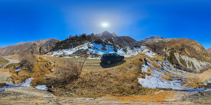 Rugged Mountain Landscape with Parked Car in Kyrgyzstan