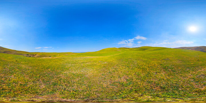 Vast Green Rolling Hills Under Clear Blue Sky Panorama