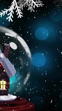 Animation of snow falling over christmas snow globe with house in winter scenery