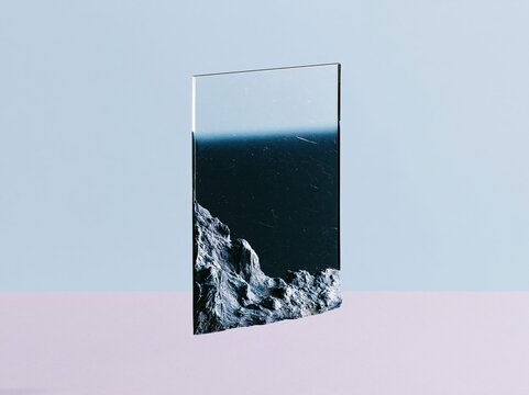 Translucent charcoal grey acetate sheet with a gradient blue field floating over a lavender surface, featuring a sleek polymer texture for atmospheric backgrounds and copy space