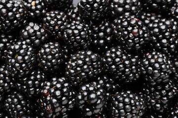 Heap of ripe tasty blackberries as background, closeup © New Africa