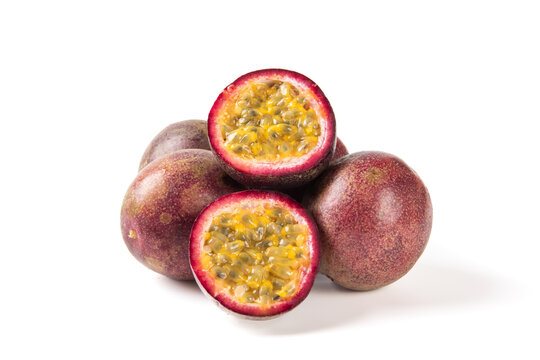 Whole and cut passion fruit isolated on white background