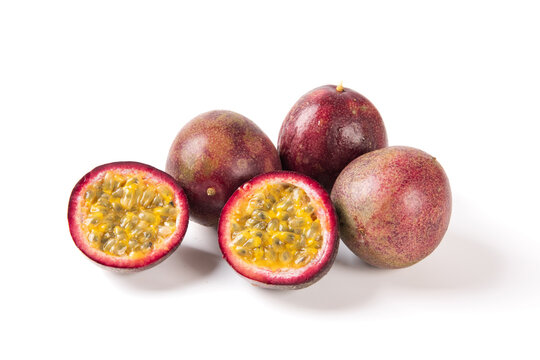 Whole and cut passion fruit isolated on white background