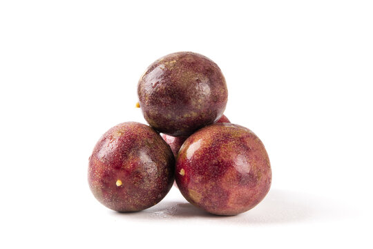whole ripe passion fruits isolated on white background