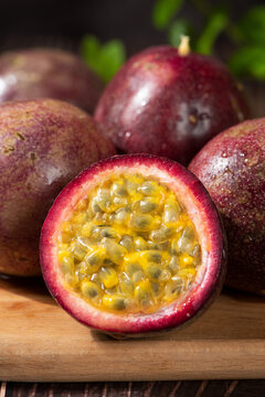 fresh ripe passion fruits on wooden table