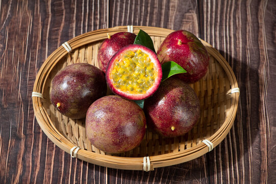 fresh ripe passion fruits on wooden table