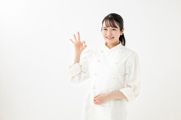 Fototapeta premium コックコートを着た女性