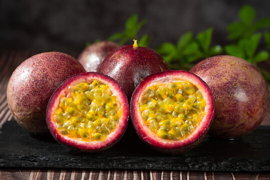 fresh ripe passion fruits on wooden table