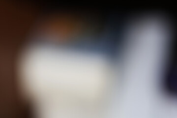 Fototapeta premium Abstract blurred background with soft light gradients and dark moody tones