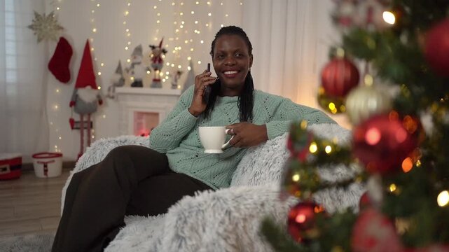 African American woman talking on the phone during Christmas holidays