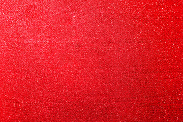 Naklejka premium Red glitter paper texture background with space. glitter star effect just like space. night sky universe rusty texture rough grain.