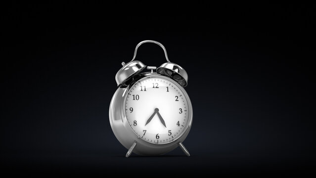 Silver twin-bell alarm clock on two legs, against a dark gradient with soft lighting.