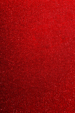 Red glitter paper texture background with space. glitter star effect just like space. night sky universe rusty texture rough grain. vertical background.