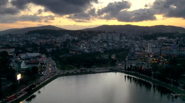 Hyperlapse of busy traffic at the roundabout near Da Lat Market and Xuan Huong Lake, Ong Dao bridge in Xuan Huong Ward, Da Lat, Lam Dong, 