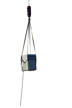 electrical equipment rigged with slings on the hook being lifted by a crane Isolated on transparent background&nbsp;