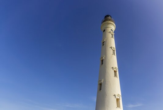 California lighthouse in Aruba against clear blue sky