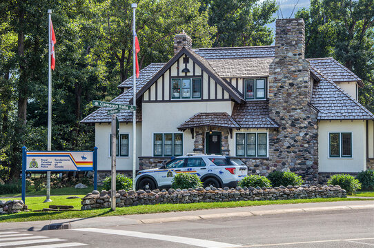 WATERTON LAKES, ALBERTA, CANADA - 22 AUGUST 2026: RCMP Police Station Building and Patrol Car in Waterton Village