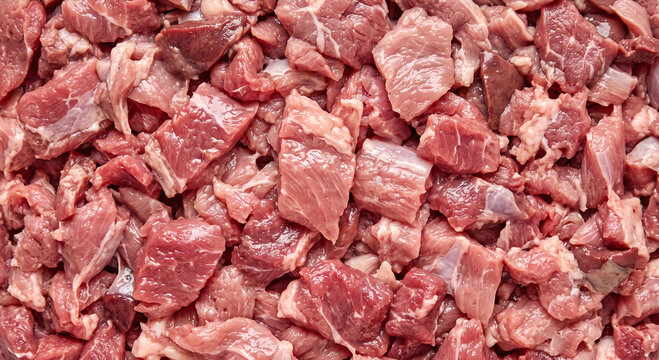 fresh raw meat fragments showing natural moisture sheen shown with fine structural detail