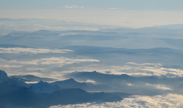 Aerial view of misty mountain ranges in the Peruvian Andes near Jauja, Peru. Layered high-altitude ridges and low clouds create an atmospheric landscape in Junin.