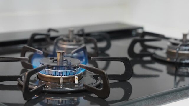 Gas Burner Igniting with Blue Flame Close Up