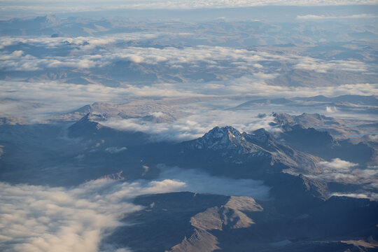 Aerial view of rugged mountains and cloud-filled valleys in the Cordillera La Viuda, Peru. High-altitude Andean landscape near Jauja and Huancayo in Junin.
