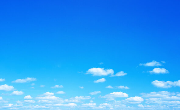 Blue sky background with a tiny clouds