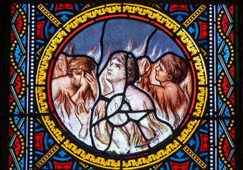 Fototapeta premium Stained glass of Souls in purgatory fire waiting for the salvation of their souls.