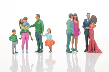 Obraz premium Miniature figures showing different groups of people in various outfits engaged in social interactions
