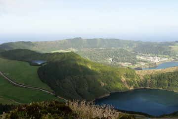 A panoramic view reveals the blue and green crater lakes surrounded by lush volcanic hills in Sete Cidades. © Евгения Руденок