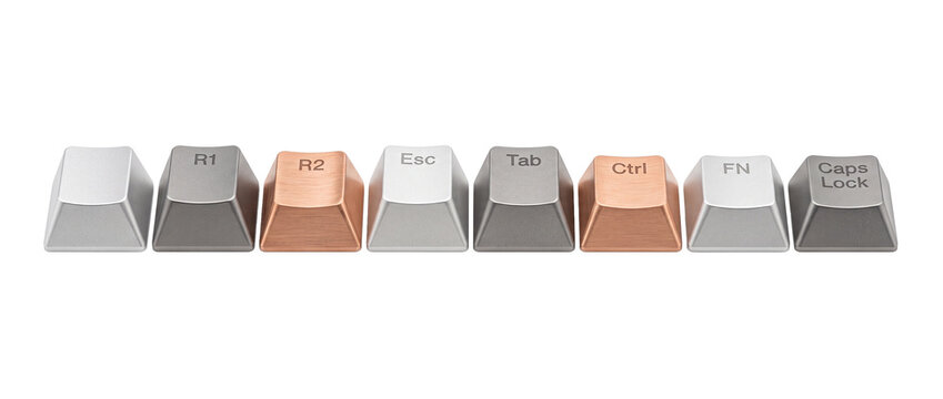 Mechanical keyboard keycaps metal custom set lined up isolated on black background for gaming desktop PC setup hardware accessories typing technology custom metal key caps row copper bronze esc cap