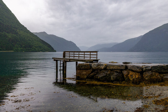 A beautiful summer  landscape with a village by the fjord . A summer scenery of World Heritage Area in Western Norway.