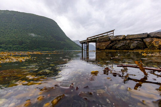A beautiful summer  landscape with a village by the fjord . A summer scenery of World Heritage Area in Western Norway.
