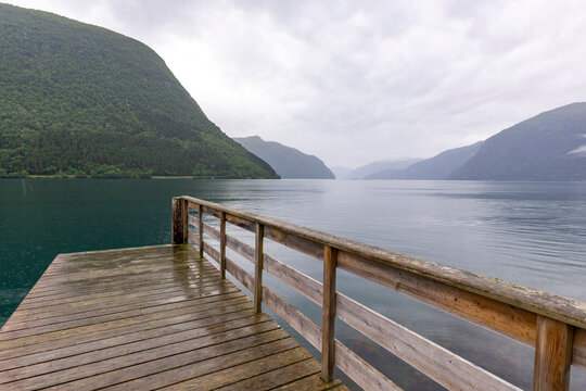 A beautiful summer  landscape with a village by the fjord . A summer scenery of World Heritage Area in Western Norway.
