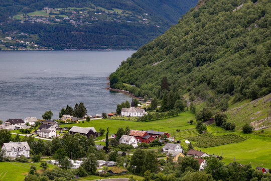 A beautiful summer  landscape with a small village at the fjord from above. A summer scenery of World Heritage Area in Western Norway.