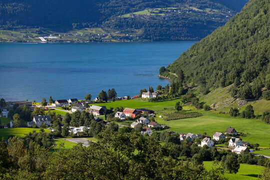 A beautiful summer  landscape with a small village at the fjord from above. A summer scenery of World Heritage Area in Western Norway.
