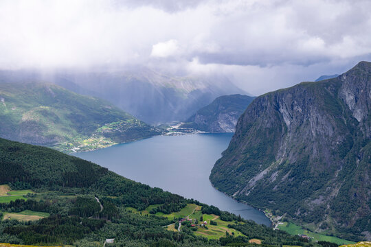 A beautiful summer  landscape with a small village at the fjord from above. A summer scenery of World Heritage Area in Western Norway.