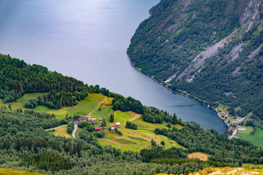 A beautiful summer  landscape with a small village at the fjord from above. A summer scenery of World Heritage Area in Western Norway.