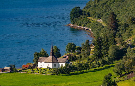 A beautiful summer  landscape with a small village at the fjord from above. A summer scenery of World Heritage Area in Western Norway.