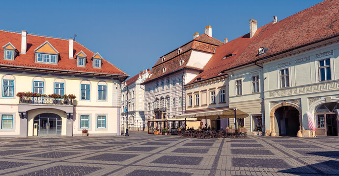 Historic facades and arcaded buildings on Piata Mare in Sibiu, Transylvania, Romania