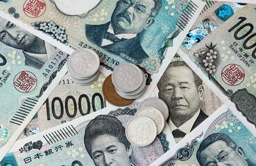 Japanese yen money banknotes and coins on table. Japan cash bills of JPY currency © Viktor