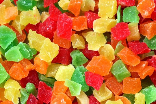 Marmalade candies of different colors texture close up top view. Coloured marmalade cubes