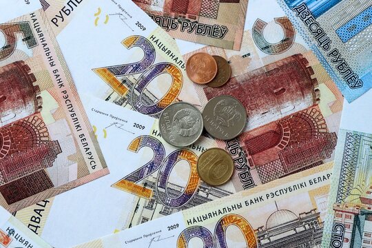 Belarusian ruble money banknotes and coins on table. Belarus cash bills of BYN currency