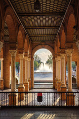 Naklejka premium View of the central fountain through arches at Plaza de Espana