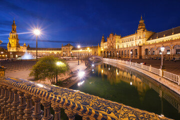 Illuminated Plaza de Espana and canal at night, Seville, Spain © Dmitry Rukhlenko