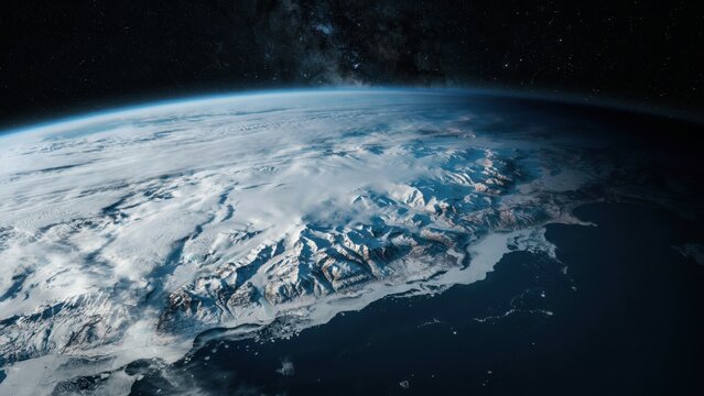 Satellite view of planet earth arctic ice caps and snow covered mountain terrain.