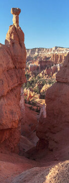 Beautiful vertical scenic view of a giant natural sandstone hoodoo rock formation under a blue sky