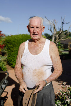 Portrait of 90 year old man after working in the garden