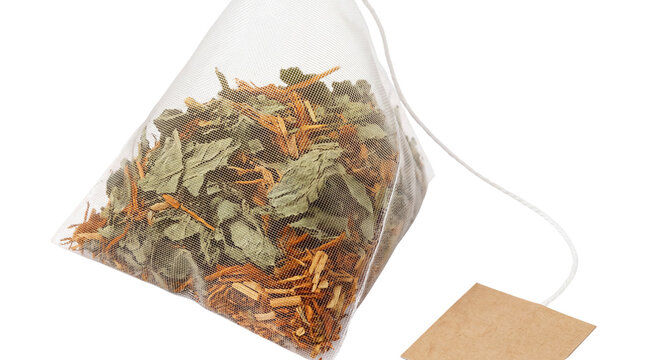 Pyramid tea bag with herbal loose leaf blend, organic mesh infuser with blank tag, premium dried tea leaves for wellness isolated PNG with Transparent Background