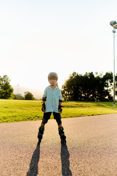 Young Boy Practicing Roller Skating at Sunset